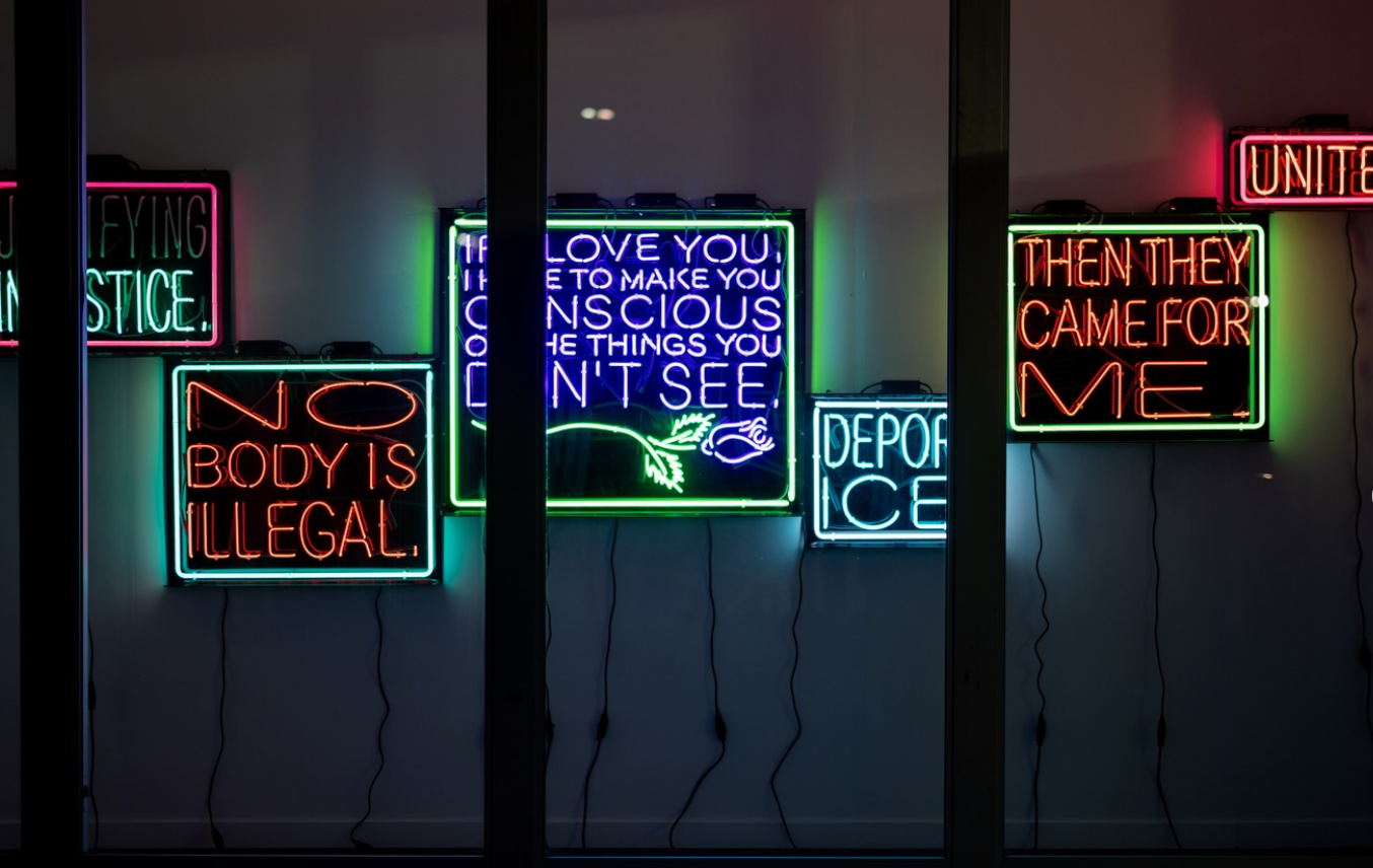 Neon works by Patrick Martinez protesting ICE at the entrance to Frieze LA 2026