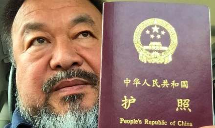 Ai Weiwei with his Passport, via The Guardian