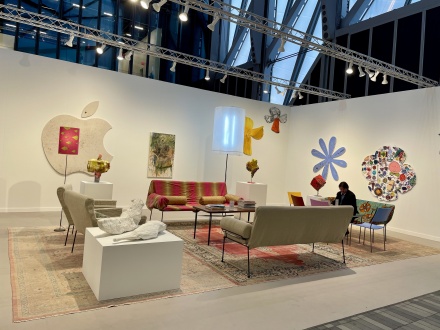 Wide shot of David Zwirner booth at Frieze NY 2024, featuring a dual show of various works by Nate Lowman and Franz West. 